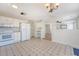 Functional kitchen and breakfast area including white appliances, cabinetry, flooring with distinctive patterned design and eat-in area at 1042 Cobblestone Blvd, Summerville, SC 29486