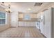 Cozy kitchen features white cabinetry, appliances, and a window allowing ample natural light at 1042 Cobblestone Blvd, Summerville, SC 29486