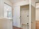 Hallway laundry room with tile flooring, washer hookups, and white doors at 1042 Cobblestone Blvd, Summerville, SC 29486
