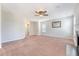 Bright living room featuring a fireplace, neutral carpet, and a ceiling fan at 1042 Cobblestone Blvd, Summerville, SC 29486