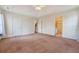 Large main bedroom boasts neutral carpet, ceiling fan, multiple entry doors, and an attached ensuite bathroom at 1042 Cobblestone Blvd, Summerville, SC 29486