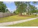 A view of the home's side yard showcasing the grassy expanse, sidewalk, and partial view of the house at 1042 Cobblestone Blvd, Summerville, SC 29486