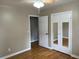 This bedroom features wood floors, a ceiling fan, and mirrored closet doors at 105 Pandora Dr, Goose Creek, SC 29445