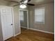 This bedroom features wood floors, a ceiling fan, and closet doors at 105 Pandora Dr, Goose Creek, SC 29445