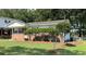 A tidy home with manicured lawn, tidy landscaping, and a brick foundation, set in a green neighborhood at 105 Pandora Dr, Goose Creek, SC 29445
