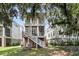 Charming backyard featuring a two-story porch and lush green lawn, great for outdoor relaxing at 1093 Ave Of Oaks, Charleston, SC 29407