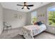 Cozy bedroom with natural light from windows and a ceiling fan at 1093 Ave Of Oaks, Charleston, SC 29407