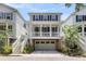 Charming two-story home with a brick-accented garage and a welcoming front porch at 1093 Ave Of Oaks, Charleston, SC 29407