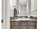 Stylish half bathroom with a modern vanity and elegant wallpaper at 1093 Ave Of Oaks, Charleston, SC 29407