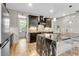 Sleek kitchen featuring dark cabinetry, stone countertops, and modern stainless steel appliances at 1093 Ave Of Oaks, Charleston, SC 29407