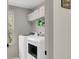 Functional laundry room with modern appliances and storage shelves at 1093 Ave Of Oaks, Charleston, SC 29407