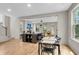 Open-concept living room flows seamlessly, featuring hardwood floors, fireplace, and abundant natural light at 1093 Ave Of Oaks, Charleston, SC 29407