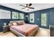 Spacious main bedroom features three large windows, a door to a balcony, and a ceiling fan at 1093 Ave Of Oaks, Charleston, SC 29407