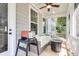 Covered porch with a cozy seating area and an outdoor grill at 1093 Ave Of Oaks, Charleston, SC 29407