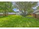 Lush backyard showcasing a large, mature shade tree, offering a serene outdoor living space at 111 Kapalua Run, Summerville, SC 29483