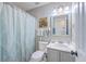 Bathroom with a toilet, vanity, and shower with a patterned shower curtain, complemented by gray paint at 111 Kapalua Run, Summerville, SC 29483