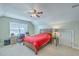Bedroom featuring a ceiling fan, desk area, and a comfortable bed with a side table at 111 Kapalua Run, Summerville, SC 29483