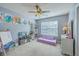 Bedroom featuring a ceiling fan, play furniture, and a window with natural light at 111 Kapalua Run, Summerville, SC 29483