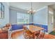 Dining room with hardwood floors, chair rail detail, and natural light from a window at 111 Kapalua Run, Summerville, SC 29483