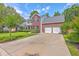Beautiful two-story home with a long driveway and a manicured front yard at 111 Kapalua Run, Summerville, SC 29483