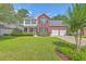 Charming two-story home with a well-manicured lawn and attached two-car garage at 111 Kapalua Run, Summerville, SC 29483