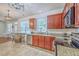 Well-lit kitchen featuring granite countertops, stainless steel appliances, and wood cabinets at 111 Kapalua Run, Summerville, SC 29483