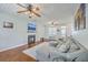 Spacious living room featuring a fireplace, ceiling fans, and stylish hardwood flooring at 111 Kapalua Run, Summerville, SC 29483