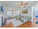 Open-concept living room with comfortable seating and hardwood floors at 111 Kapalua Run, Summerville, SC 29483