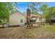 Backyard view showcasing the home's exterior, patio area, and fenced yard at 116 Runnymede Ln, Summerville, SC 29485