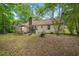 Rear exterior showcasing the home's backyard, and patio at 116 Runnymede Ln, Summerville, SC 29485