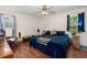 Primary bedroom featuring wood floors, large window, ceiling fan and ensuite bath at 116 Runnymede Ln, Summerville, SC 29485