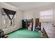 Bedroom featuring green carpet, a large window with natural light, and ample storage at 116 Runnymede Ln, Summerville, SC 29485