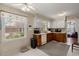 Traditional-style kitchen with white cabinets, window view and decorative wallpaper at 116 Runnymede Ln, Summerville, SC 29485