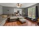 Cozy living room with a large window, plush seating, and hardwood flooring at 116 Runnymede Ln, Summerville, SC 29485