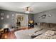 Relaxing living area with ample seating, hardwood floors, and plenty of natural light at 116 Runnymede Ln, Summerville, SC 29485