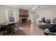 Spacious living area with a brick fireplace, dining table, and functional workspace at 116 Runnymede Ln, Summerville, SC 29485