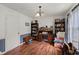 Bright office with a large desk, ample bookshelves, and a comfortable chair at 116 Runnymede Ln, Summerville, SC 29485