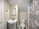 Small bathroom featuring a vanity with basin sink, toilet, and a shower behind a curtain at 121 Woodland Dr, Summerville, SC 29485