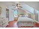 Bedroom featuring hardwood flooring, a ceiling fan, with a door leading to the ensuite bathroom at 121 Woodland Dr, Summerville, SC 29485