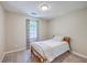 Cozy bedroom featuring neutral paint, plush carpet, and a full sized bed with a decorative window at 121 Woodland Dr, Summerville, SC 29485