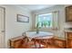 Cozy breakfast nook featuring a bay window, built-in benches, and a quaint round table perfect for morning meals at 121 Woodland Dr, Summerville, SC 29485