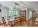 Charming dining room featuring hardwood floors, a bay window, and a traditional table with seating for six at 121 Woodland Dr, Summerville, SC 29485