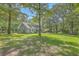 Charming two-story home featuring dormer windows, a well-manicured lawn, and mature trees at 121 Woodland Dr, Summerville, SC 29485