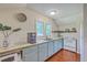 Bright kitchen featuring custom cabinets, wood countertops, and stainless steel appliances at 121 Woodland Dr, Summerville, SC 29485
