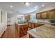 Spacious kitchen with granite countertops, wood cabinets, a central island, and stainless steel appliances at 121 Woodland Dr, Summerville, SC 29485