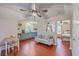 Open concept living area with hardwood floors that connects the living room, kitchen, and additional bedroom at 121 Woodland Dr, Summerville, SC 29485