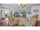 Inviting living room with hardwood floors, built-in shelving, fireplace and comfortable seating at 121 Woodland Dr, Summerville, SC 29485