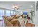 Relaxing living room with plush furniture, a ceiling fan, and a view of the backyard at 121 Woodland Dr, Summerville, SC 29485