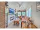 Eclectic living room with stone fireplace, TV, comfortable seating, ceiling fan, and unique decor at 121 Woodland Dr, Summerville, SC 29485