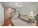 Cozy living room featuring hardwood floors, a sofa, and a staircase at 121 Woodland Dr, Summerville, SC 29485